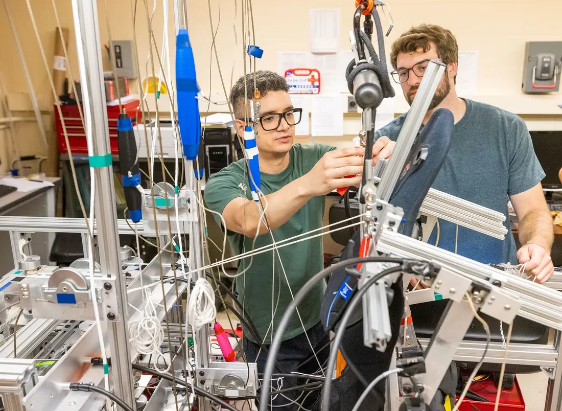 Two graduate students working together in laboratory.